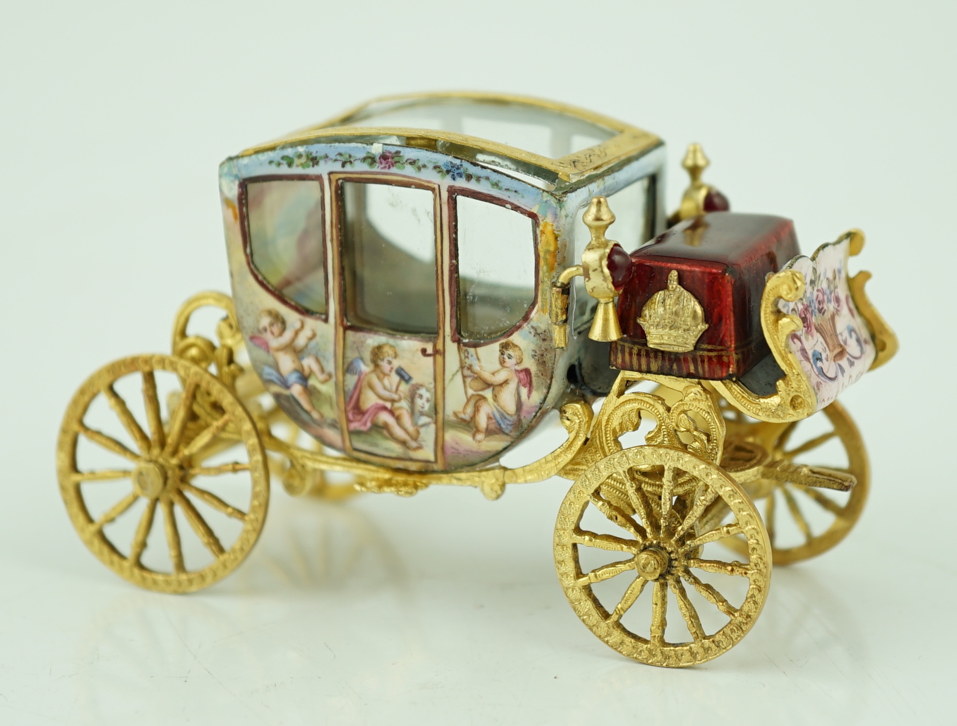 An early 20th century Viennese silver gilt and enamel miniature model of carriage, by Ludwig Pollitzer?